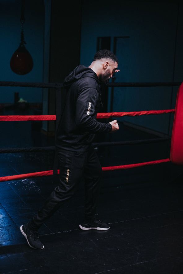 TRACKSUIT «TRUST NO ONE GOLD» PRETO