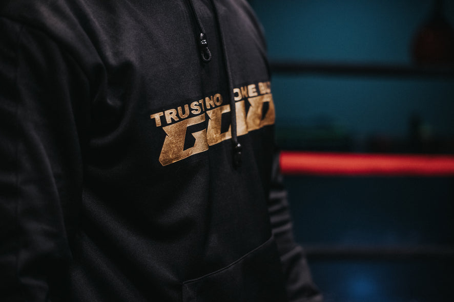 TRACKSUIT «TRUST NO ONE GOLD» PRETO