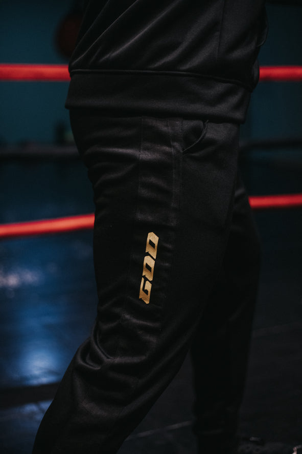 TRACKSUIT «TRUST NO ONE GOLD» PRETO